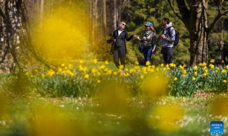 People visit a spring flower exhibition at the Volcji Potok Arboretum near Kamnik, Slovenia, April 3, 2026. (Photo by Zeljko Stevanic/Xinhua)
