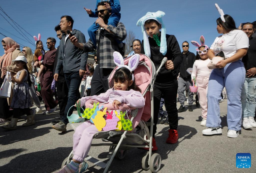 People take part in the annual Easter Parade at Ladner Village in Delta, British Columbia, Canada, on April 5, 2026. The annual Easter event, a community tradition of more than 60 years, featured a festive parade and family-oriented activities, drawing local residents to celebrate the holiday. (Photo by Liang Sen/Xinhua)