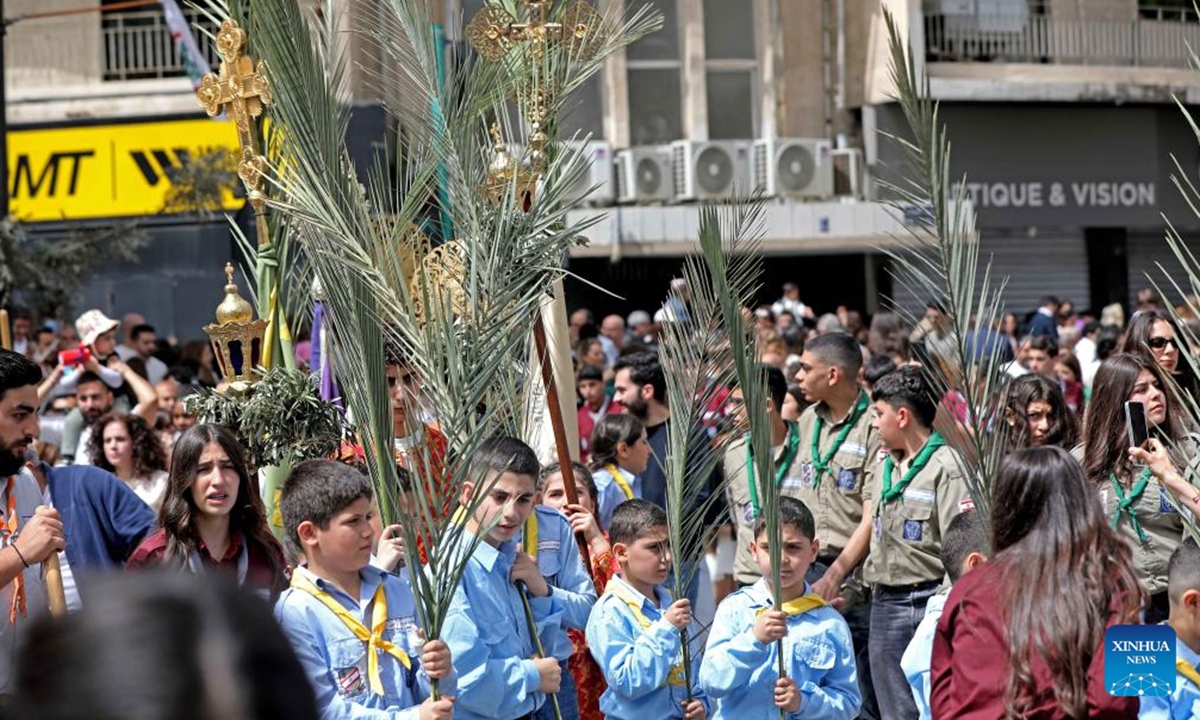Christians celebrate Palm Sunday in Beirut, Lebanon, April 5, 2026. Palm Sunday, a Christian feast that falls on the Sunday before Easter, marks the beginning of the Holy Week. (Photo by Bilal Jawich/Xinhua)