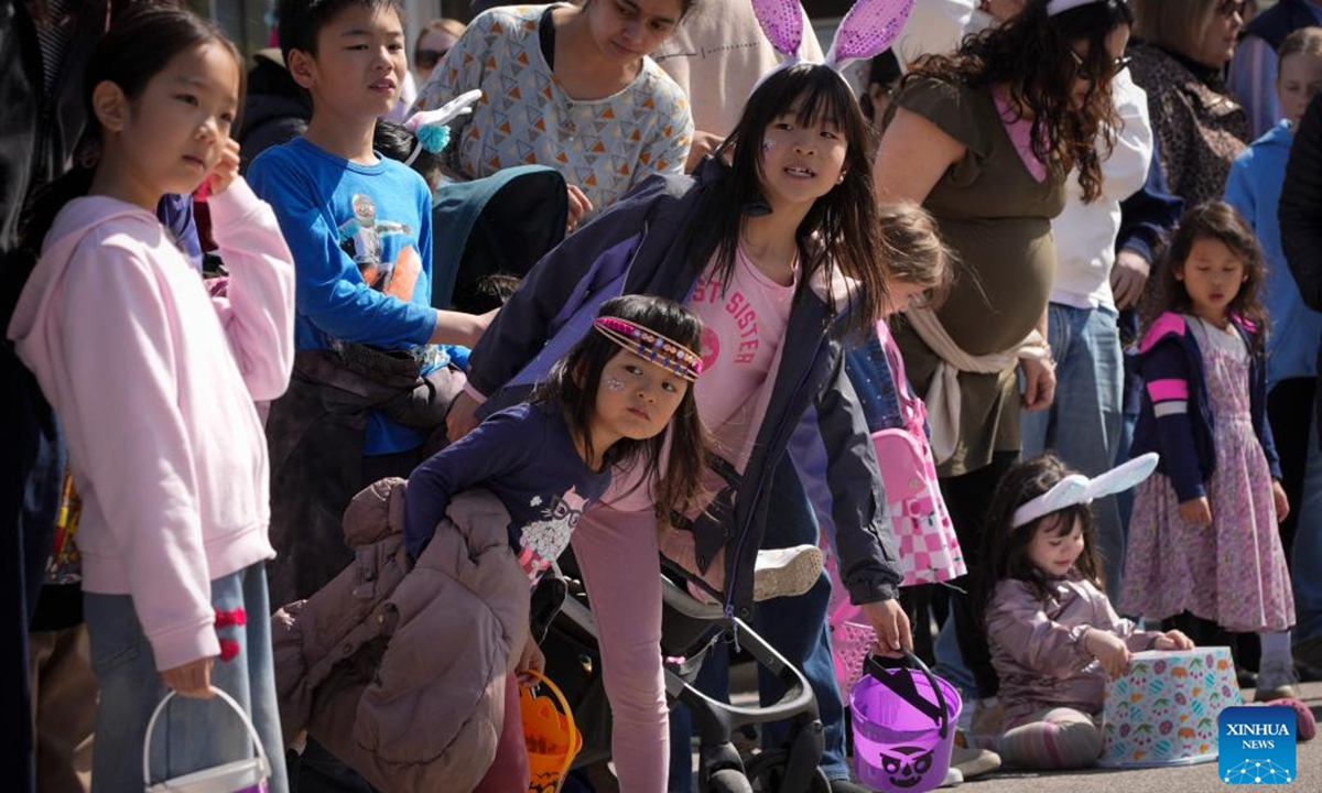 Children watch the annual Easter Parade at Ladner Village in Delta, British Columbia, Canada, on April 5, 2026. The annual Easter event, a community tradition of more than 60 years, featured a festive parade and family-oriented activities, drawing local residents to celebrate the holiday. (Photo by Liang Sen/Xinhua)