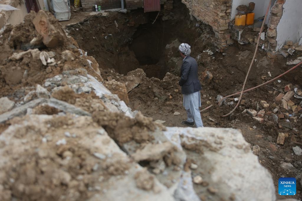 A man checks damage after a house has collapsed during heavy rains in Kabul, capital of Afghanistan, April 5, 2026. The death toll from heavy rainfall-triggered flooding across Afghanistan has risen to at least 99 people, with 154 others injured over the past nine days, a spokesman for the National Disaster Management Authority said on Sunday. (Photo by Saifurahman Safi/Xinhua)