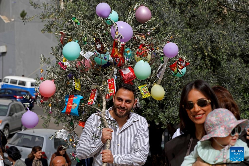 Christians celebrate Palm Sunday in Beirut, Lebanon, April 5, 2026. Palm Sunday, a Christian feast that falls on the Sunday before Easter, marks the beginning of the Holy Week. (Photo by Bilal Jawich/Xinhua)
