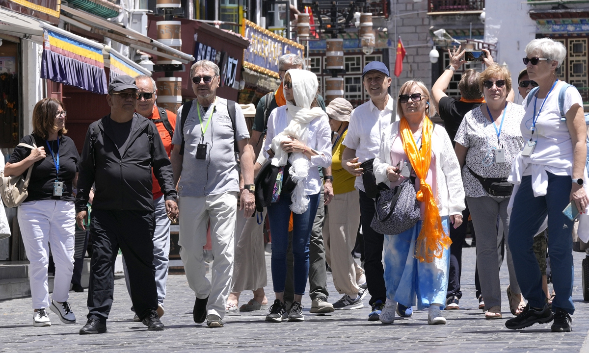 Foreign tourists visit the old city area of Barkhor Street in Lhasa, Southwest China's Xizang Autonomous Region, on June 10, 2025. Photo: VCG