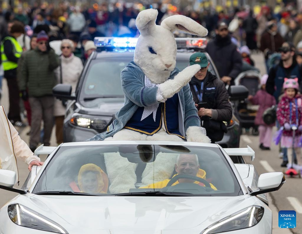 The Easter Bunny waves to the crowd during the 2026 Toronto Beaches Lions Easter Parade in Toronto, Canada, on April 5, 2026. (Photo by Zou Zheng/Xinhua)