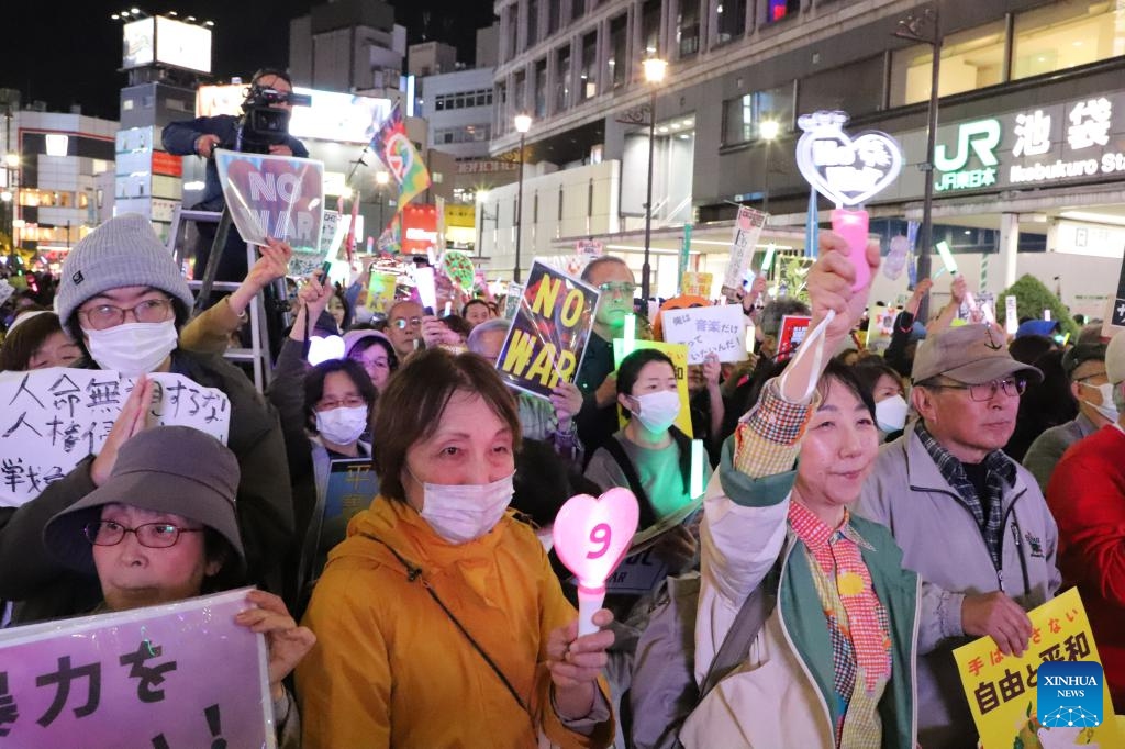 People participate in a protest outside the Ikebukuro station in Tokyo, Japan, on April 5, 2026. (Xinhua/Li Ziyue)