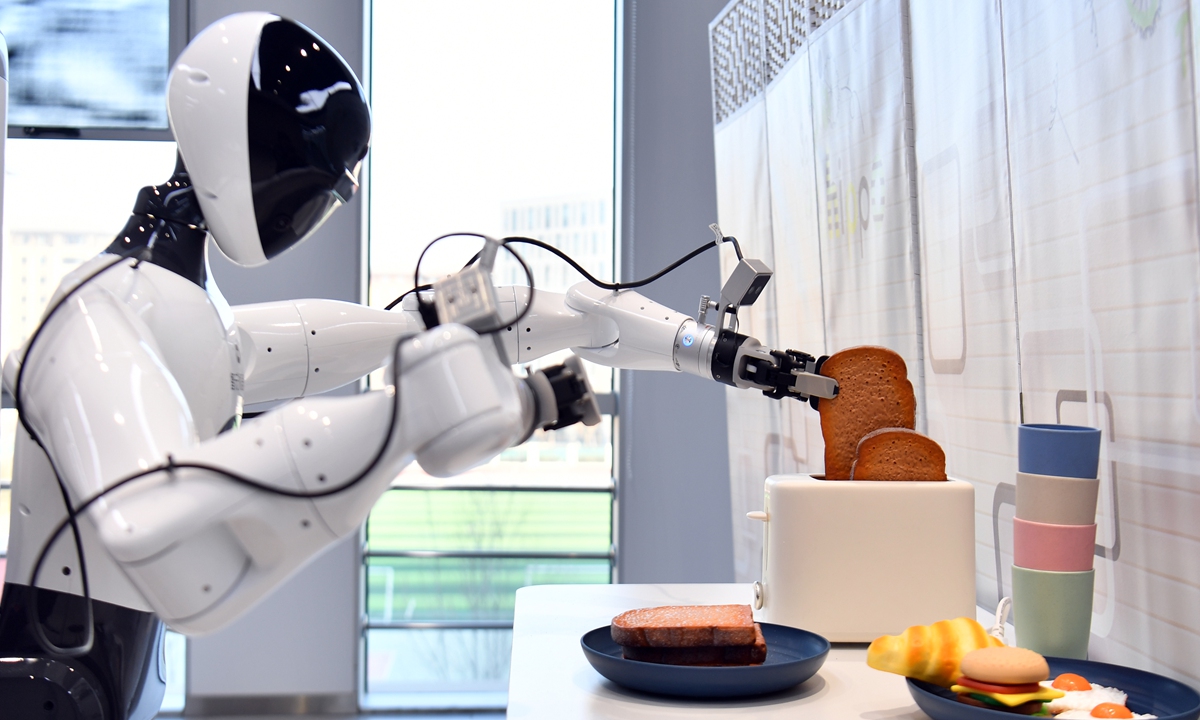 A robot undergoes training for home living application scenarios at a company in Xiong'an on January 8, 2026. Photo: VCG