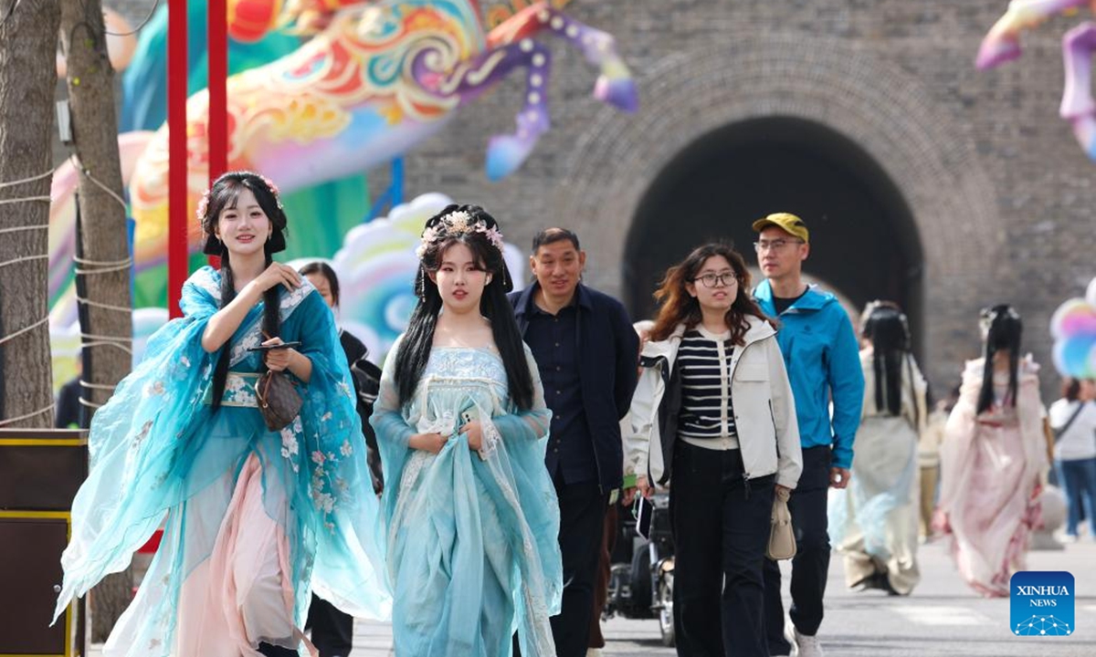 Tourists visit the Zhengding ancient city in Shijiazhuang, north China's Hebei Province, April 5, 2026. China recorded 135 million domestic tourist trips during the three-day Qingming Festival holiday, up 6.8 percent from a year earlier, while tourism spending rose 6.6 percent to nearly 61.37 billion yuan (8.9 billion U.S. dollars), according to the Ministry of Culture and Tourism on Tuesday. (Photo by Liang Zidong/Xinhua)