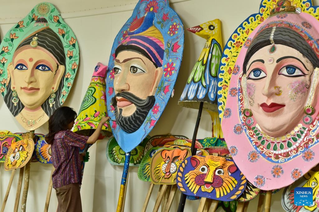 An artist creates an artwork in preparation for the upcoming Bengali New Year, or Pahela Baishakh, at the Faculty of Fine Arts of University of Dhaka in Dhaka, Bangladesh, April 6, 2026. (Photo by Habibur Rahman/Xinhua)