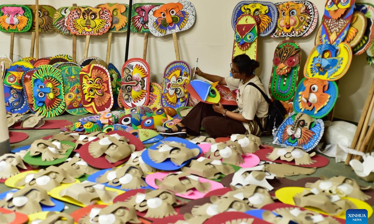 An artist creates an artwork in preparation for the upcoming Bengali New Year, or Pahela Baishakh, at the Faculty of Fine Arts of University of Dhaka in Dhaka, Bangladesh, April 6, 2026. (Photo by Habibur Rahman/Xinhua)