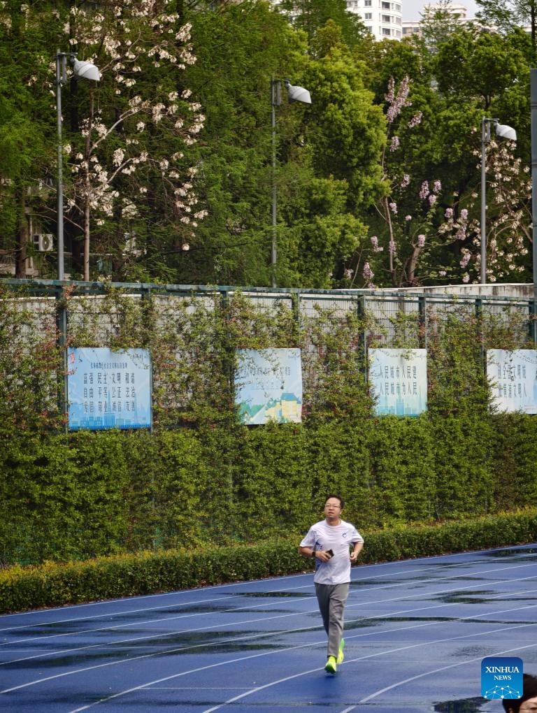 A man jogs at the Luwan Stadium in east China's Shanghai, April 9, 2026. (Xinhua/Xing Guangli)

