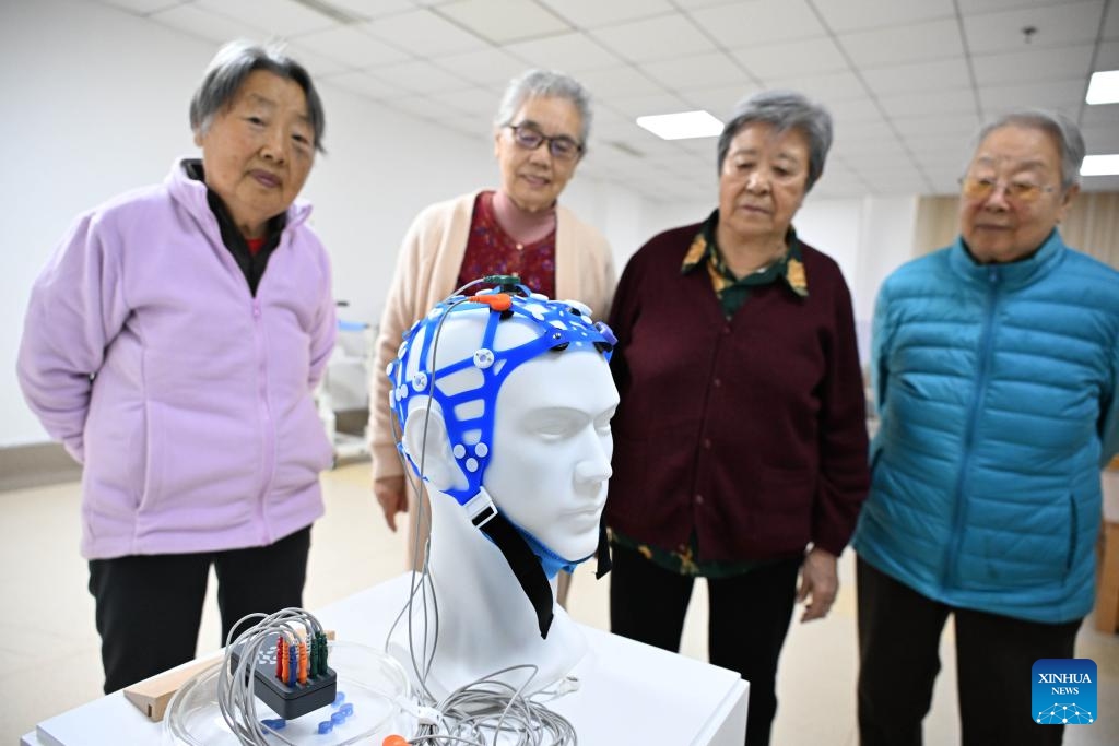 Elderly people learn about brain-computer interface (BCI) devices at Qingdao Training Center for Elderly Care Robots in Qingdao, east China's Shandong Province, April 9, 2026. (Xinhua/Li Ziheng)

