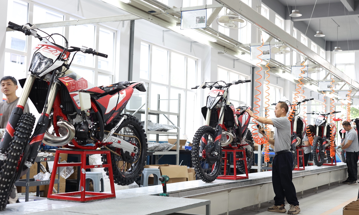 Workers assemble export-oriented off-road racing motorcycles at Chongqing Maideng Motorcycle Co in Shapingba district in Southwest China's Chongqing Municipality on April 9, 2026. Customs data showed that China's export volume rose 22.25 percent year-on-year in the first two months of 2026, while export value was up by 24.90 percent year-on-year. This shift indicates that China's motorcycle industry is undergoing a transformation toward high-quality development - shifting from 