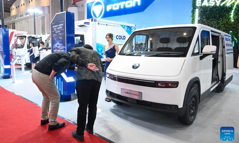 Visitors look at electric vehicles during GAIKINDO Indonesia International Commercial Vehicle Expo (GIICOMVEC) 2026 in Jakarta, Indonesia, April 8, 2026. The expo kicked off here on Wednesday. (Xinhua/Zulkarnian)

