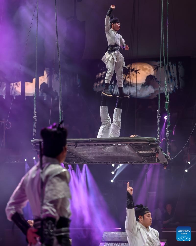 Members of China's Jiangsu Acrobatic Troupe perform in Soaring Above the Waves, an acrobatic act combining teeterboard, trampolines and a rocking platform, during the Ringlispil circus show at the Capital Circus of Budapest in Budapest, Hungary, April 8, 2026. Featuring acrobatic masters from various countries, the Ringlispil circus show takes place here from April 4 to 12. (Photo by David Balogh/Xinhua)