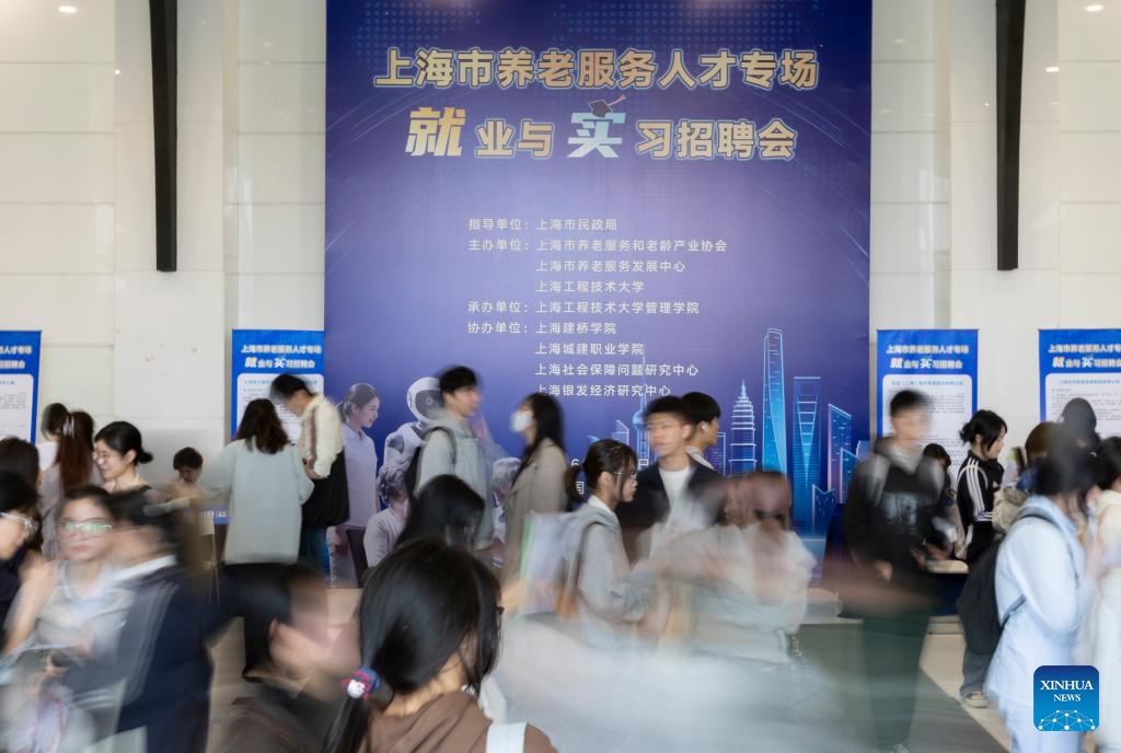 This photo taken on April 9, 2026 shows a job fair on Songjiang campus of Shanghai University of Engineering Science in east China's Shanghai. The job fair for the elderly care service was held here on Thursday. Nearly 50 organizations and enterprises offered over a hundred opportunities. (Xinhua/Wang Xiang)

