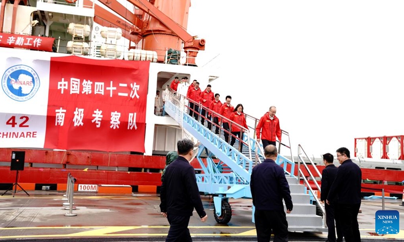 Members of China's 42nd Antarctic expedition team disembark from China's research icebreaker Xuelong in Shanghai, east China, April 9, 2026. Xuelong, or Snow Dragon, returned to Shanghai on Thursday after a 160-day-long voyage which formed part of the country's 42nd Antarctic expedition. (Xinhua/Zhang Jiansong)

