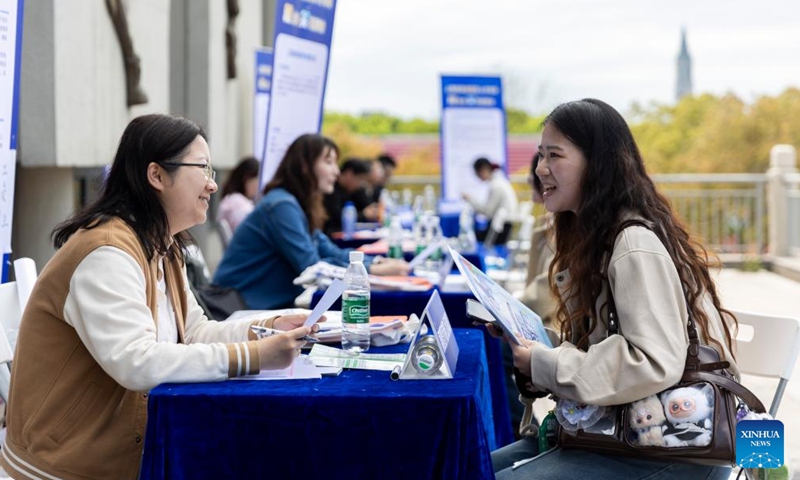 A job seeker talks with a recruiter at a job fair on Songjiang campus of Shanghai University of Engineering Science in east China's Shanghai, April 9, 2026. The job fair for the elderly care service was held here on Thursday. Nearly 50 organizations and enterprises offered over a hundred opportunities. (Xinhua/Wang Xiang)

