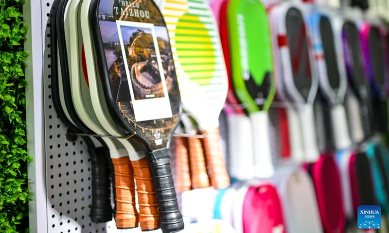 Pickleball paddles are pictured at a display hall of a sports goods manufacturing enterprise in Linhai, Taizhou City, east China's Zhejiang Province, April 10, 2026. In recent years, Taizhou City has encouraged the cluster development of its sports goods manufacturing industry, forming several clusters including outdoor jackets, outdoor leisure products, sports glasses, and cycling and related outdoor products. (Xinhua/Jiang Han)
