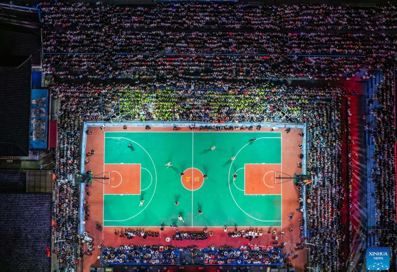 An aerial drone photo shows the basketball court of the final match between Kaili City and Yanhe County at the 2026 China's Village Basketball Competition in Taipan Village, Taijiang County, southwest China's Guizhou Province, April 11, 2026. (Xinhua/Yang Wenbin)