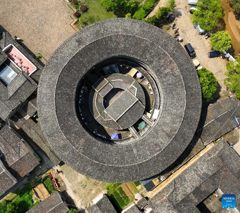 An aerial drone photo taken on April 9, 2026 shows Huaiyuanlou in Nanjing County, southeast China's Fujian Province. Tulou, the unique residential architecture of Fujian Province, was inscribed on the UNESCO's World Heritage List in 2008. In recent years, local authorities has continued promoting Tulou protection, revitalization, and integration with tourism. (Xinhua/Lin Shanchuan)