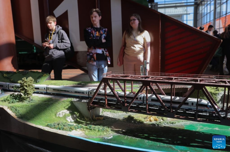 People view exhibits during an exhibition of train and railway dioramas in St. Petersburg, Russia, on April 11, 2026. The exhibition kicked off here on Saturday, showcasing over 240 train and railway dioramas from Russia and other countries. The event runs until April 19. (Photo by Irina Motina/Xinhua)