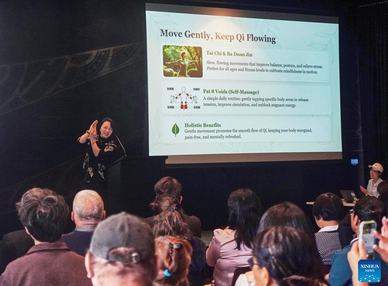 An expert from Zhejiang Chinese Medical University gives a lecture at the Chinese + TCM South Island Roadshow in Christchurch, New Zealand, April 11, 2026. The Chinese + TCM (traditional Chinese medicine) South Island Roadshow was held here on Saturday. A team from Zhejiang Chinese Medical University engaged local audiences with lectures, interactive demonstrations and hands-on activities during the event. (Photo by Chen Siyumeng/Xinhua)
