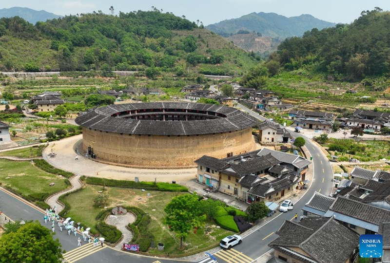 An aerial drone photo taken on April 10, 2026 shows Eryilou in Zhangzhou City, southeast China's Fujian Province. Tulou, the unique residential architecture of Fujian Province, was inscribed on the UNESCO's World Heritage List in 2008. In recent years, local authorities has continued promoting Tulou protection, revitalization, and integration with tourism. (Xinhua/Lin Shanchuan)