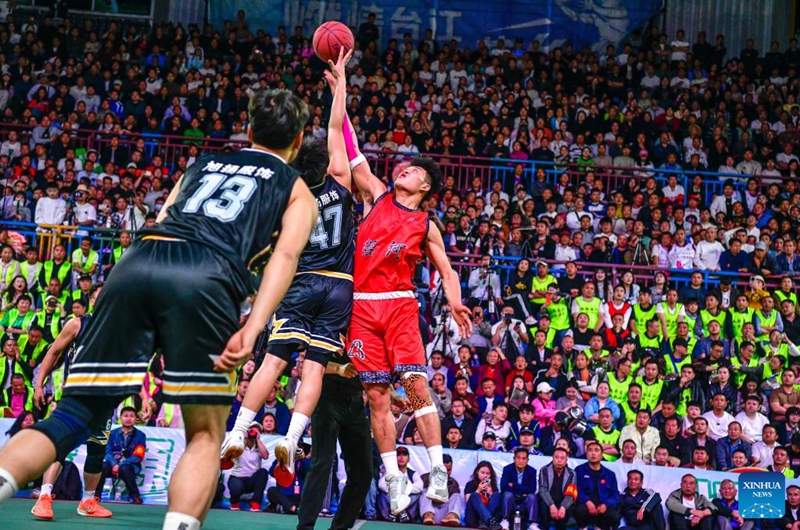 Players of both teams jump for the ball during the final match between Kaili City and Yanhe County at the 2026 China's Village Basketball Competition in Taipan Village, Taijiang County, southwest China's Guizhou Province, April 11, 2026. (Xinhua/Yang Wenbin)