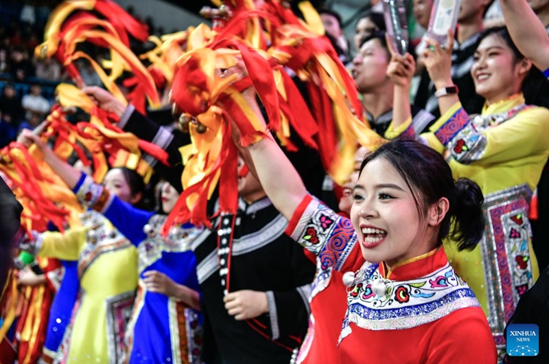Fans with ethnic costumes cheer during the final match between Kaili City and Yanhe County at the 2026 China's Village Basketball Competition in Taipan Village, Taijiang County, southwest China's Guizhou Province, April 11, 2026. (Xinhua/Yang Wenbin)