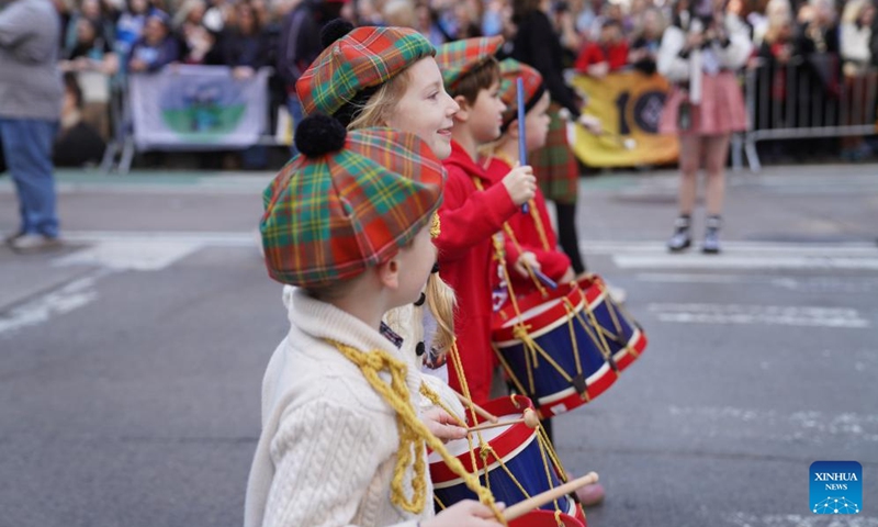 Children march during the annual Tartan Day Parade in New York, the United States, on April 11, 2026. More than 3,000 bagpipers, highland dancers and other participants marched to celebrate the annual Tartan Day here on Saturday. The event was held to mark the existing and historical links between Scotland and Scottish descendants in the U.S.. (Xinhua/Zhang Fengguo)