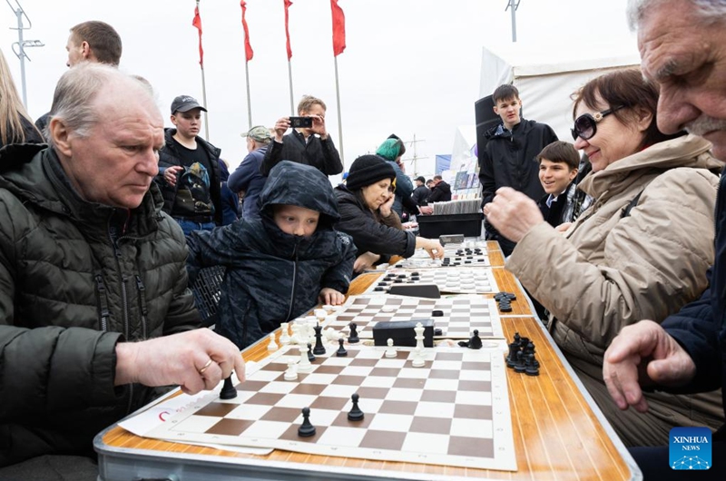 People play chess in the city center square of Vladivostok, Russia, April 12, 2026. Various recreational activities were hosted on Sunday to mark the Orthodox Easter holiday. (Photo by Andrey Matveenko/Xinhua)