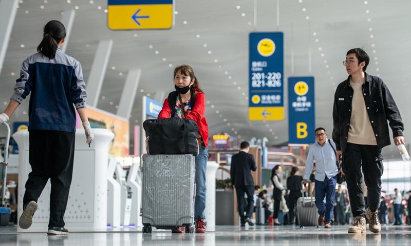 Passengers walk at the Terminal 2 of Wuhan Tianhe International Airport in Wuhan, central China's Hubei Province, April 15, 2024. (Xinhua/Wu Zhizun)