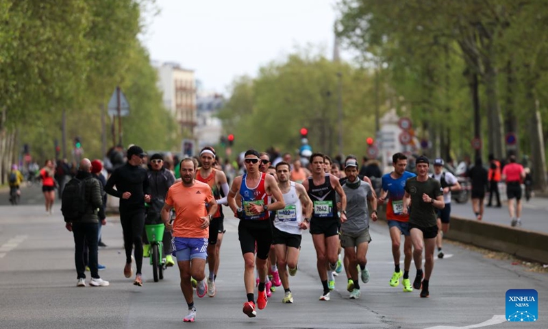 Participants run during the Paris Marathon 2026 in Paris, France, April 12, 2026. (Xinhua/Wu Huiwo)