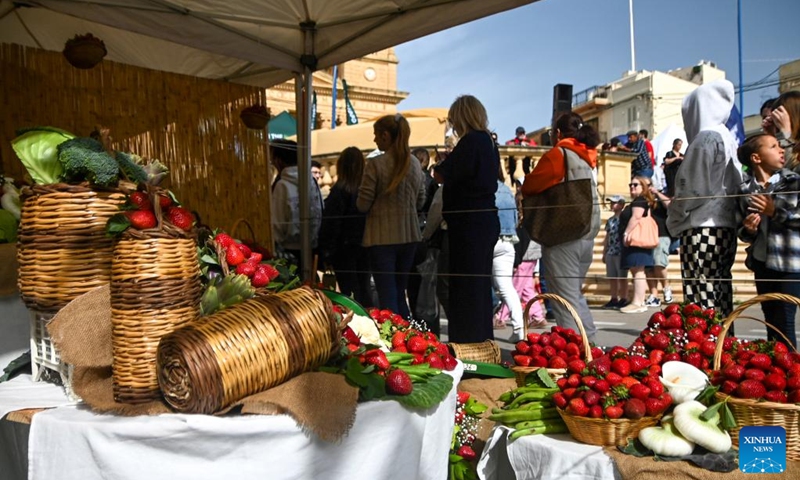 People visit the strawberry festival in Mgarr, Malta, April 12, 2026. Malta held its annual strawberry festival in Mgarr on Sunday. (Photo by Jonathan Borg/Xinhua)