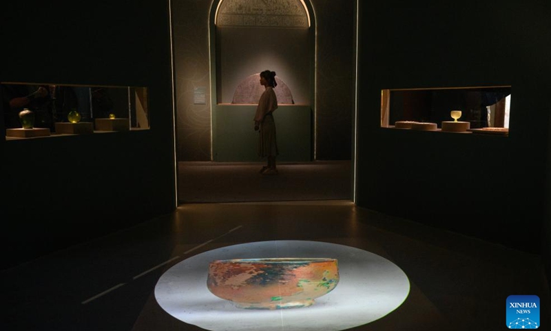 A visitor views the exhibition A Glimpse into 6th-7th Century China: Discoveries at Li Jingxun's Tomb at the National Museum of China in Beijing, capital of China, April 13, 2026. The ongoing exhibition features relics unearthed from the tomb of Li Jingxun, a young princess who died in 608, and recently discovered key relics from the Northern and Southern Dynasties (420-589) to the Sui Dynasty (581-618). (Xinhua/Jin Liangkuai)
