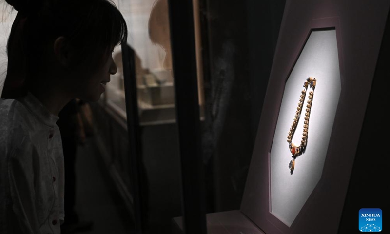 A visitor views the exhibition A Glimpse into 6th-7th Century China: Discoveries at Li Jingxun's Tomb at the National Museum of China in Beijing, capital of China, April 13, 2026. The ongoing exhibition features relics unearthed from the tomb of Li Jingxun, a young princess who died in 608, and recently discovered key relics from the Northern and Southern Dynasties (420-589) to the Sui Dynasty (581-618). (Xinhua/Jin Liangkuai)