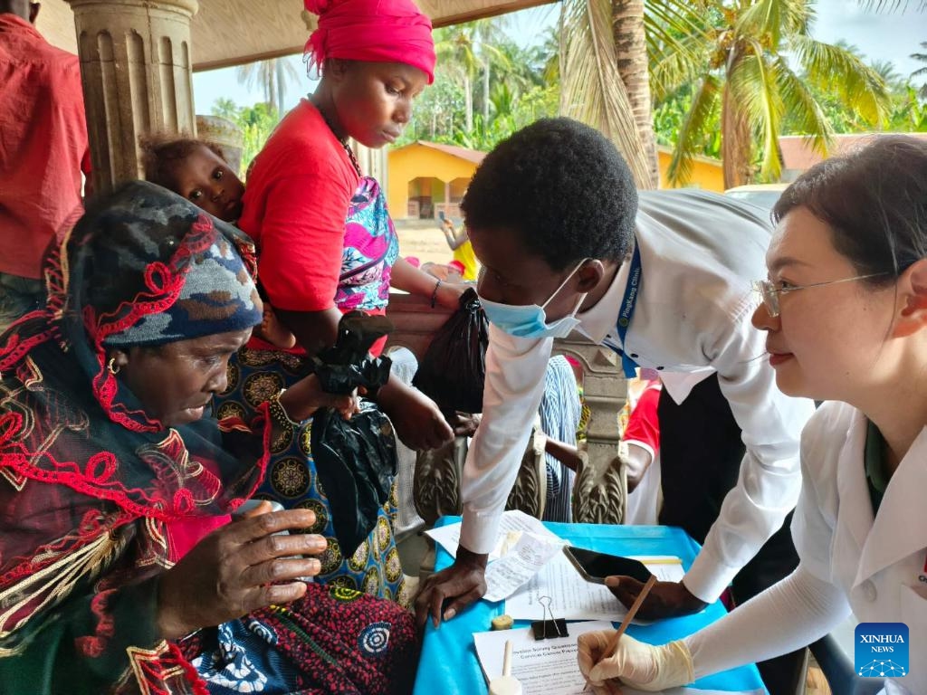 A member of the 27th batch of the Chinese medical team in Sierra Leone provides medical consultation for a villager of Rokel Village in the North West Province, Sierra Leone, April 12, 2026. The 27th batch of the Chinese medical team in Sierra Leone has conducted its first free clinic in Rokel Village in the North West Province, providing medical services to nearly 300 villagers. (The 27th batch of the Chinese medical team in Sierra Leone/Handout via Xinhua)

