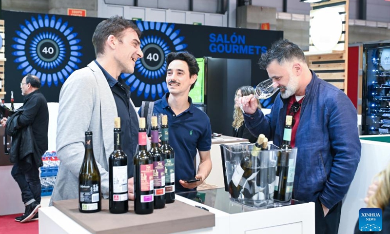 A visitor tastes wine during the Salon Gourmets in Madrid, Spain on April 13, 2026. The 39th Salon Gourmets will run in Madrid from April 13 to 16. (Photo by Gustavo Valiente/Xinhua)