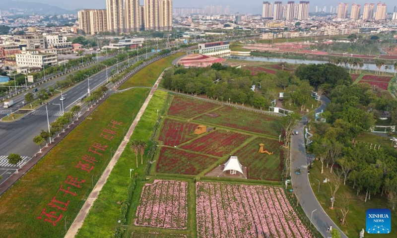 An aerial drone photo taken on April 12, 2026 shows a view of the Long Jiang Years tourist area in Zhangzhou City, southeast China's Fujian Province.

