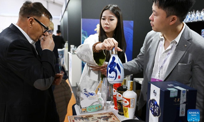 A visitor tastes Fenjiu, a type of Chinese liquor, at the 58th international wine and spirits exhibition Vinitaly in Verona, Italy, April 13, 2026. Running from April 12 to 15 this year, the international wine and spirits exhibition Vinitaly, Italy's oldest and prestigious wine fair, attracts enterprises and professional visitors from nearly 130 countries and regions. (Photo by Alberto Lingria/Xinhua)

