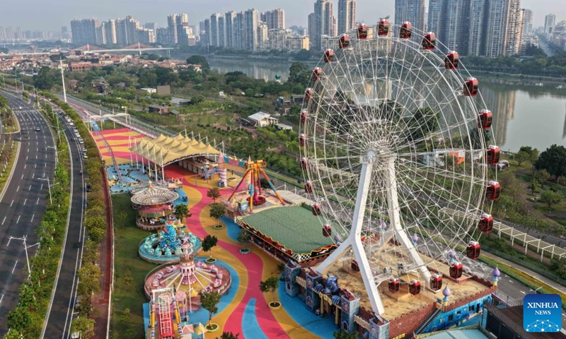 An aerial drone photo taken on April 12, 2026 shows amusement facilities in the Long Jiang Years tourist area in Zhangzhou City, southeast China's Fujian Province.

