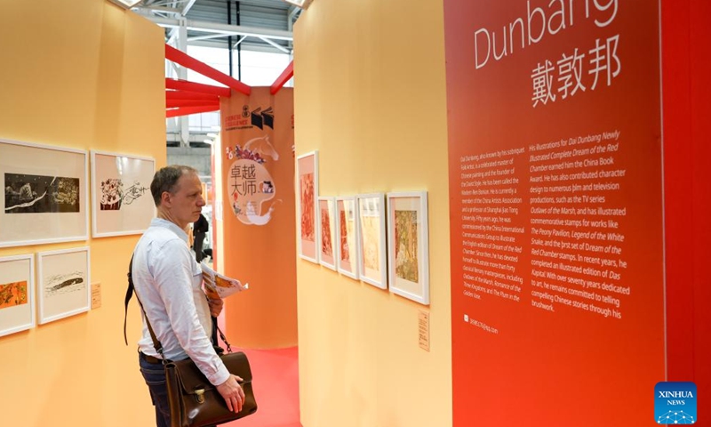 A visitor checks the Chinese exhibition area during the 63rd Bologna Children's Book Fair in Bologna, Italy, April 13, 2026. The 63rd Bologna Children's Book Fair opened on Monday in the Italian city of Bologna. (Xinhua/Wang Kaiyan)


