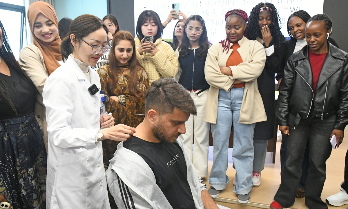 International students from Anhui University of Science and Technology in Huainan, East China's Anhui Province, visit and experience traditional Chinese medicine acupuncture at the First Affiliated Hospital of Anhui University of Science and Technology on April 15, 2026. Photo: VCG