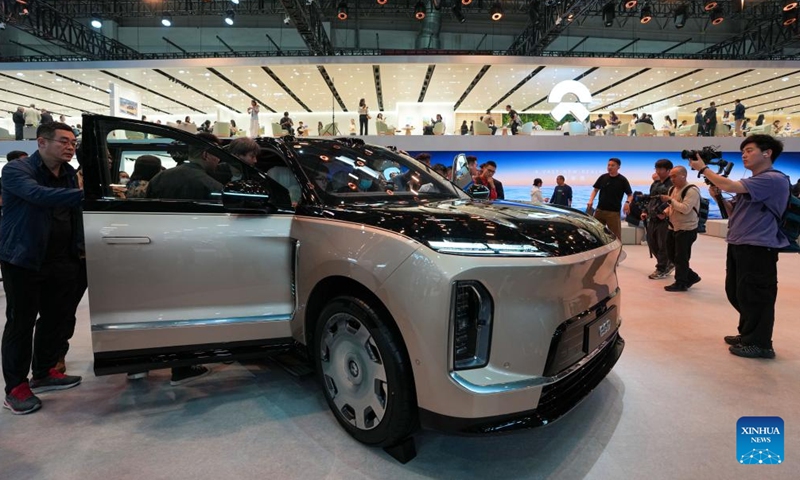 People visit the booth of NIO during the 2026 Beijing International Automotive Exhibition in Beijing, capital of China, April 24, 2026. The exhibition kicked off here on Friday and will last until May 3. (Xinhua/Ju Huanzong)

