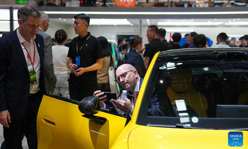 People visit the booth of Xiaomi during the 2026 Beijing International Automotive Exhibition in Beijing, capital of China, April 24, 2026. The exhibition kicked off here on Friday and will last until May 3. (Xinhua/Ju Huanzong)

