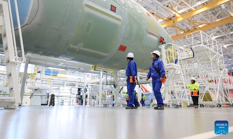 Staff members work at Airbus' second A320 family final assembly line in Tianjin, north China, Nov. 17, 2025. (Airbus/Handout via Xinhua)

