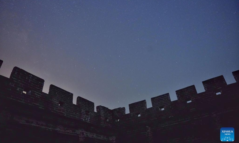 This photo taken on April 15, 2026 shows a view of the starry sky above the Jinshanling section of the Great Wall in Chengde City, north China's Hebei Province. (Photo by Wang Junfeng/Xinhua)