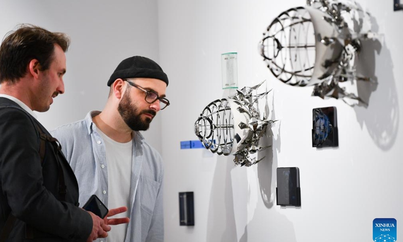 People view exhibits by the Chinese watch brand BEHRENS during the Watches and Wonders Geneva 2026 at the Palexpo in Geneva, Switzerland, April 14, 2026. The 7-day event kicked off here on Tuesday, bringing together 65 participating brands. (Xinhua/Lian Yi)

