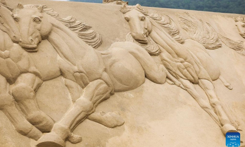 This photo taken on April 14, 2026 shows a partially completed sand sculpture at the Nansha scenic area in Zhujiajian, Zhoushan City, east China's Zhejiang Province. (Xinhua/Xu Yu)