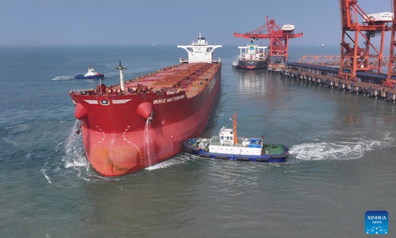 A drone photo taken on April 15, 2026 shows a vessel departing from the ore terminal of Caofeidian Port Area in Tangshan Port in Tangshan, north China's Hebei Province. From January to March this year, Caofeidian Port Area handled a cargo throughput of 138.03 million tonnes, marking a year-on-year increase of 3.16 percent. (Xinhua/Yang Shiyao)

